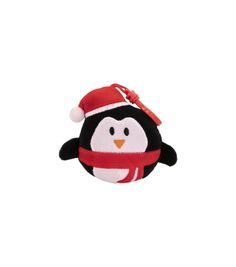 a stuffed penguin with a red scarf around it's neck, wearing a santa hat