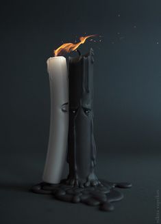 a lit candle sitting on top of a table next to black rocks and water droplets