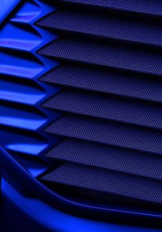 the front grille of a blue sports car