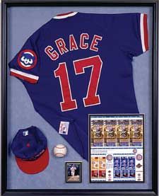 a baseball jersey and cap are on display in a shadow box with the number 17