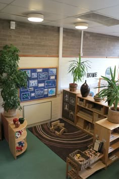 an image of a room that is very clean and empty with plants on the desk