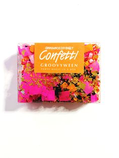 an orange and pink confetti bar on a white background