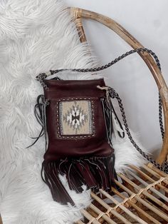 "Get ready to rock that boho-chic look with the Pranee Eliza Crossbody bag in genuine handmade leather! Perfect for carrying all your essentials, the fringe detailing adds a touch of fun and play to your style. This is the ultimate statement piece for the free-spirited fashion lover! (Psst...makes for a great conversation starter too!)" Bohemian Shoulder Bag For Fall, Bohemian Brown Bag With Beaded Fringe, Bohemian Shoulder Bag With Tassels For Fall, Bohemian Fall Bags With Tassels, Bohemian Bags With Beaded Fringe For Everyday Use, Bohemian Leather Hobo Bag For Fall, Artisan Brown Bag With Fringe, Brown Artisan Bags With Fringe, Artisan Brown Bags With Fringe