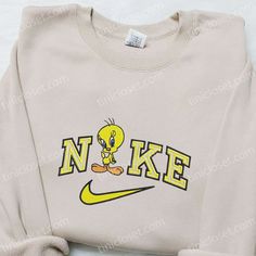 The Nike x Tweety Cartoon Embroidered Sweatshirt is a playful and stylish addition to your wardrobe. Made with high-quality materials, it features an adorable Tweety Bird embroidery on the front, adding a touch of nostalgia and charm. The sweatshirt is comfortable and cozy, perfect for lounging or casual outings. With its unique design and iconic Nike branding, this sweatshirt is sure to turn heads and make a statement. Elevate your style with this limited edition collaboration and show off your Nike Christmas, Nike Cartoon, Nike Inspired, Mirabel Madrigal, Walt Disney Characters, Best Family Gifts, Embroidered Shirts, Cartoon Shirts, Cartoon Christmas