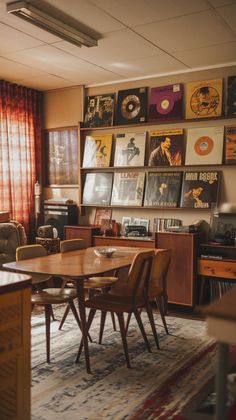 a living room filled with furniture and lots of records