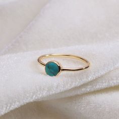 "Materials Gold, Rose gold, White gold Gemstone: turquoise Turquoise Ring / Round Cut Turquoise Ring In 14k Gold / Stackable Turquoise Ring / Natural Turquoise / December Birthstone Ring / Fine Ring Item Features * Made to Order. * Gold KT: 14K * Custom Gold Color: Rose Gold, Yellow Gold, White Gold * Gemstone Cut: Round * Number of Stones: 1 * Stone Size: 4 mm * Setting Type: Bezel * Band Width: 1.25mm * Ring is marked gold Marked * ready to Ship in 7-10 Business Days * Also available in other Gold Turquoise Ring With Gemstone, Gold Turquoise Ring Fine Jewelry, Dainty Gold Turquoise Gemstone Ring, Dainty Gold Turquoise Ring, Gold Turquoise Gemstone Promise Ring, Gold Turquoise Promise Ring, Gold Turquoise Ring Gift, Gold Turquoise Ring For Gift, Gold Turquoise Ring Birthstone For Gift