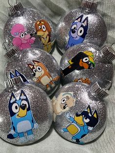 the cartoon characters are painted on these ornaments