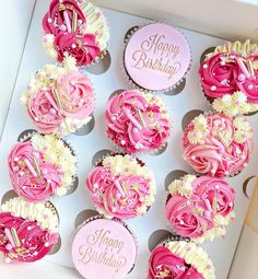 pink and white cupcakes in a box with happy birthday written on the top