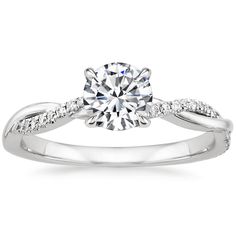 a white gold engagement ring with diamonds on it