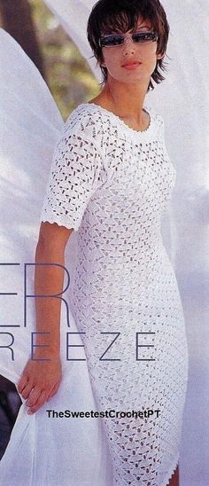 a woman in a white crochet dress posing for a magazine cover with her hand on her hip