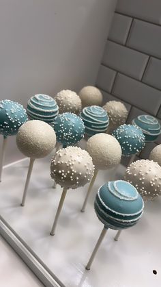 there are many blue and white cake pops