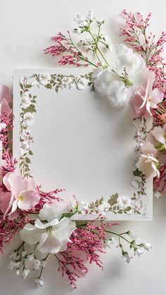 flowers are arranged around the edge of an empty card