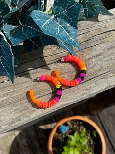 Neon orange colored hoops beaded with size 11 seed beads. Orange Adjustable Beaded Earrings For Festival, Adjustable Orange Beaded Earrings For Festival, Fun Orange Beaded Jewelry, Orange Hoop Earrings With Colorful Beads, Handmade Orange Hoop Earrings For Summer, Trendy Handmade Orange Hoop Earrings, Trendy Orange Beaded Earrings For Summer, Orange Beaded Earrings With Round Beads For Festival, Orange Round Beaded Earrings For Festivals