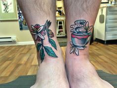 two people with matching tattoos on their legs