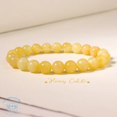 "Honey Calcite Beaded Bracelet Yellow Gemstone Stone Stretch Bracelet Meditation Yoga Bracelet Crystal Gift for Mom Friends Everyday Wear Material : Honey Calcite, Gemstone Stones, Natural Crystal, Raw Stone Quality: AAA+ Length: fit for 6.3 ~ 7.3 inches wrists Beads size: 8mm Your bracelet will arrive beautifully packaged in a gift bag ,The bracelet is made on non fray stretch nylon cord for strength and flexibility. All beads are carefully selected. When you put on and off your bracelet \"roll\" it on instead of stretching to avoid putting stress on the elastic. This will keep the high quality elastic in better condition for a longer time. It is a unique and meaningful gift for yourself or someone special. Perfect cool gift that anyone will love! These happy bracelet can't help but make Elegant Yellow Stretch Bracelet With Round Beads, Elegant Yellow Beaded Stretch Bracelet, Elegant Yellow Stretch Bracelet, Elegant Yellow Bracelets With 8mm Beads, Elegant Amber Beaded Bracelets With 8mm Beads, Mom Friends, Honey Calcite, Yellow Gemstones, Yoga Bracelet