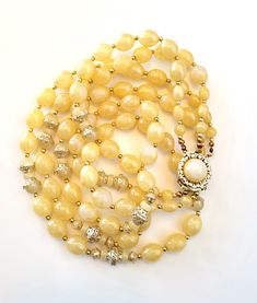 Vintage yellow Lucite and filigree beads triple strand necklace.  It measures 21 inches and has a lovely round clasp signed Hong Kong. I have restrung the entire piece on nylon covered stainless steel wire.  Good vintage condition, some peeling on some of the beads but this doesn't affect their colour. This was taken into account when pricing. INTERNATIONAL SHIPPING - PLEASE READ Item ships regular mail. If you would like to include a tracking number, please be sure to upgrade your shipping meth Filigree Necklaces, Stainless Steel Wire, Multi Strand Necklace, Vintage Yellow, Strand Necklace, Multi Strand, Tracking Number, Hong Kong, Etsy Accessories