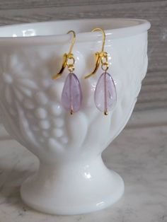 Amethyst earrings,dainty and fun for work or a night out. Hanging on a gold tone latch ear wire. All earrings are handmade to be as close as possible but every stone is unique and individual. Made to be loved and enjoyed. Everyday 14k Gold Filled Earrings With French Hook, Elegant Nickel-free Lavender Earrings, Elegant Lavender Nickel-free Earrings, Gold Wire Wrapped Teardrop Earrings For Gift, Elegant Lavender Earrings With Ear Wire, Gold Crystal Drop Earrings For Everyday Wear, Purple Dangle Teardrop Earrings With Ear Wire, Elegant Purple Earrings For Everyday, Handmade Teardrop 14k Gold Filled Earrings