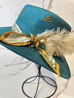 This stiff brim teal fedora is a size large. Please check our size guide before bringing this one home. It has an elastic inner band for an exceptional fit. Hat Bands, One Home, Love Hat, Hello Gorgeous, Cute Hats, Hat Band, Custom Hats, Fedora, Caps Hats