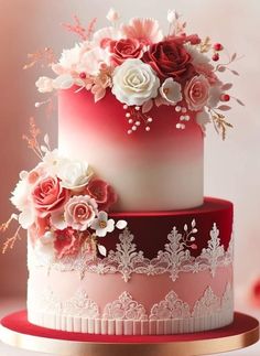 a three tiered cake with pink and white flowers on top