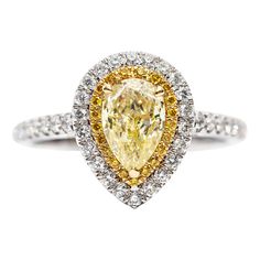 An extremely impressive and bespoke GIA Certified 0.70 - 0.85 ( 7x5 mm) Carat Natural Fancy Yellow Pear Shaped Diamond which is set in the centre of the Ring with Double Halo, the inner halo features 0.08 Carat Round Fancy Yellow Diamonds with 0.38 Carat Color G/H White Round Brilliant Diamonds on the outer halo and around the sides giving this beautiful Double Halo Diamond Engagement Ring an exclusive look and adds timeless glamour in its 18 Karat White Gold setting, please note, when remaking your unique creation, Hasbani Diamonds will hand pick the centre pear shape yellow diamond with an approximate measurement of 7mm x 5mm and no less than 0.70 Carat in weight. This striking piece has a British Hallmarked. Luxury Vvs Clarity Yellow Gold Halo Ring, Yellow Pear Diamond Ring, Luxury Gia Certified Pear-shaped Wedding Ring, Gia Certified Luxury Pear-shaped Jewelry, Luxury Gia Certified Pear-shaped Rings, Luxury Pear-shaped Gia Certified Rings, Luxury Yellow Pear-shaped Ring, Luxury Platinum Pear-shaped Rings, Gia Certified Teardrop Ring For Anniversary