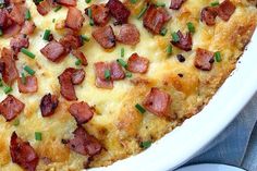 a close up of a casserole with bacon on it