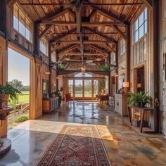 the inside of a large building with lots of windows and wood trimming on it