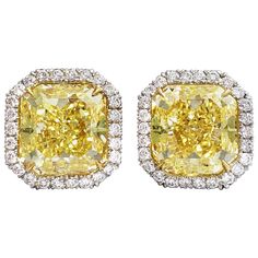 Natural GIA-certified fancy intense yellow radiant-cut diamond earrings, featuring 4.79 and 4.94 carats respectively, on a platinum and 18k yellow gold setting. Classic radiant-cut fancy intense yellow diamond earrings with VS2 clarity, with 52 white diamonds (0.67 TCW) forming a halo setting. Simultaneously classic and extravagant, this pair of intense yellow diamond studs from Scarselli offers an exciting deviation from the usual diamond studs featured in every woman’s jewelry collection. With Radiant Cut Diamond Earrings, Yellow Diamond Earrings, Yellow Diamond Earring, Vintage Stud Earrings, Yellow Diamonds, Fancy Yellow Diamond, Radiant Cut Diamond, Star Earrings Stud, Yellow Gold Setting