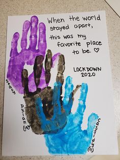 a handprint on a piece of paper with words written in blue, purple and black