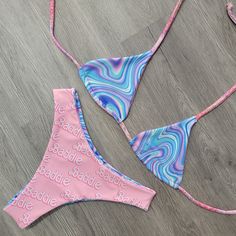 Say goodbye to dull pool days! Get ready to turn heads in this Barbie Triangle Blue reversible bikini top. With its cool blue color and dreamy summer vibes, you'll be the baddie of the pool with this stylish and cozy top! Get the perfect summer look today! Trendy Triangle Top Swimwear For Beach Party, Trendy Triangle Top Swimwear For Beach Season, Trendy Tie-side Bottom Swimwear For Beach Party, Trendy Tie-side Swimwear For Beach Party, Trendy Swimwear For Poolside And Beach Season, Fun Blue Swimwear For Beach Season, Trendy Swimwear For Beach Party, Trendy Swimwear For Sunbathing, Trendy Swimwear For Beach Season Sunbathing