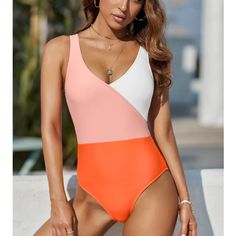 One Piece Bathing Suit In Orange ,Punk And White Size Large New Never Worn Casual Pink V-neck Swimwear, Pink Color Block Swimwear For Summer, Summer Color Block Pink Swimwear, Trendy Pink V-neck Swimwear, White Color Block Swimwear For Spring, Casual Pink Color Block Swimwear, Nike One Piece Swimsuit, Colorblock Swimsuit, Halter Neck Swimsuit