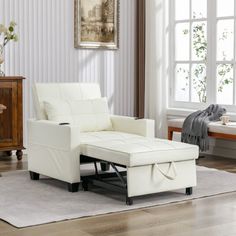 a white chair and ottoman in a living room