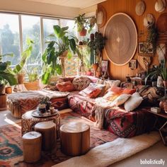 a living room filled with lots of plants and furniture