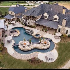 an aerial view of a large home with a pool