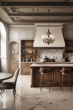 an elegant kitchen with marble floors and wooden cabinets, chandelier above the island