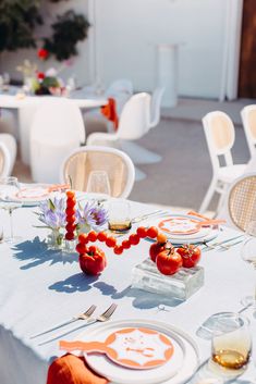 the table is set with plates and glasses