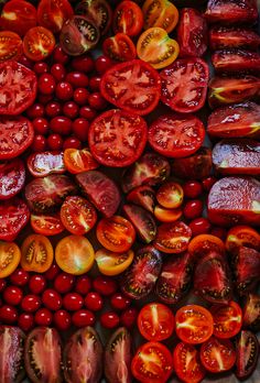 tomatoes and other fruits are arranged in a pattern