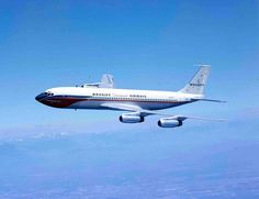 an airplane is flying in the sky above some clouds and blue skies with no one on it