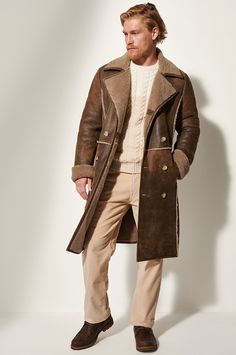 Designed for maximum coverage, the Highlander sheepskin coat is a prime example of fine tailoring and skilled craftsmanship. Its handsome, double-breasted construction, generous notch collar, shearling-out seam lines, and extra length are based on archival designs. A striking presence, this rich shearling coat will reliably shield you from whatever bitter cold you may encounter, whether in the scenic outdoors or under the skyline of a bustling city. Luxury Leather Outerwear With Double-breasted Button, Luxury Leather Double-breasted Outerwear, Fitted Classic Sheepskin Fur Coat, Fitted Sheepskin Fur Coat, Winter Leather Outerwear With Double-breasted Buttons, Winter Leather Double-breasted Outerwear, Luxury Brown Pea Coat With Lapel Collar, Elegant Long Shearling Coat, Luxury Brown Pea Coat For Winter