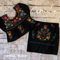 Hand Embroidered Mexican Two Piece Crop Top and Skirt in Puebla design. Skirt has inside lining and a side zipper. Top has elastic on sleeves. Available in multiple sizes and colors. Each set has a unique design. Made of 100% cotton poplin fabric. Match it with one of our Mexican Accessories: Espadrilles, Necklace, Shawl or Mexican Clutch. Perfect for any Mexican Themed party celebration. Puebla dresses available in Little Girls sizes. Look at our entire Puebla Collection here. Refer to size cha Fitted Embroidered Cotton Skirt, Fitted Cotton Skirt With Embroidered Hem, Black Cotton Skirt With Floral Embroidery, Mexican Accessories, Mexican Boutique, Mexican Themed Party, Puebla Dress, Design Skirt, Mexican Blouse