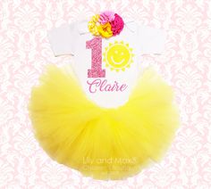 "YOUR ARE MY SUNSHINE BIRTHDAY TUTU SET \" FREE STANDARD SHIPPING IN USA!\" TOP: Premium quality bodysuit or shirt professionally heat pressed No- shed glitter vinyl in \" Your little one's name + any number+ sun silhouette\" S/S= Short Sleeves L/S= Long Sleeves FLOWER HEADBAND: Matching FLOWER headband embellished with shabby and JEWELED flowers. ( if you need it on hard headband or on alligator clip, please leave a note to seller during checkout) TUTU: We use all high quality made in USA tulle Fun White Tutu Dress For Birthday, Yellow Tutu Dress For Birthday, Yellow Tutu Dress For Birthday In Summer, Playful Spring Birthday Tutu Dress, Playful Tutu Dress For Birthday In Spring, Summer Princess Tutu Dress For Birthday, Fun Tulle Tutu Dress For Birthdays, Princess Style Summer Tutu Dress For Birthday, Princess Style Tutu Dress For Summer Birthday