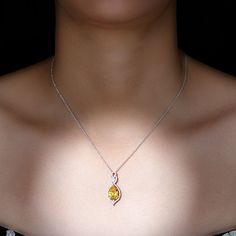 Product Details Discover the exquisite charm of the Teardrop Pendant, radiating a timeless elegance that captivates. The pear-shaped created yellow sapphire effortlessly enchants, accompanied by brilliant Diamond stones that infuse a mesmerizing sparkle. With a graceful suspension, this pendant transforms into the perfect accessory, elevating any outfit and making a resounding declaration of sophistication and grace. Product Information SKU SHP-PENDANT062310076 Weight 2.96 gm (Approximate) LAB C Yellow Pendant, Sapphire Pendant, Teardrop Pendant, Pendant Design, Yellow Sapphire, Brilliant Diamond, Diamond Stone, Pear Shaped, Prong Setting