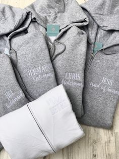 Get ready in style with a super soft full zip hoodie that you and your bridesmaids will actually cherish and use after your big day! These full zip fleece hoodies are perfect for protecting your dresses or covering up pjs while having your makeup and hair done on the big day.  Each hoodie can be personalized on the upper left chest with your new last name. Mrs in modern cursive font with your last name in Classic all capital letters. Please note that the Classic font is all capitals letters- if you would like matching names for bridesmaids, please specify Cursive or Classic font. Basic brand is Port and Co, and Gildan may be substituted. Bella Canvas is a premium brand and the ultimate softness, it is a lightweight sponge fleece. If you need to confirm a specific brand, please reach out be Bridal Party Sweatsuit, Bridesmaids Sweat Suits, Bridal Party Sweat Suits, Bridesmaid Hoodies Getting Ready, Wedding Day Getting Ready Outfit, Bridesmaid Sweatshirts Getting Ready, Bridal Party Sweatshirts Getting Ready, Wedding Getting Ready Sweatshirt, Bridal Party Zip Up Hoodies