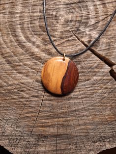 This pendant has been hand carved out of Organic Rosewood. All of my pieces are carved by hand using rescued wood from fallen trees or from carpenters leftovers. In this way I bring value to the precious woods coming from our forests protectors most magnificent trees. Barn Wood Projects, Wood Necklace, Autumn Trees, Round Pendant, Barn Wood, Wood Projects, Pendant Necklaces, Jewelry Necklace Pendant, Hand Carved