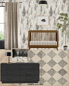 a baby's room with a crib, dresser and wallpaper in it