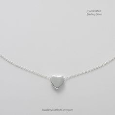 We create 925 sterling silver jewelry for you. This dainty tiny 3D Heart design celebrates the spirit of love.  This heart design represents a symbol of love, passion, adoration, femininity and sensuality. It makes you feel good and gives you self-confidence. Sleep well and sweet dreams. Heart: 6 mm Choose the sterling silver chain: 16 inch or 18 inch. Clasp type: spring ring All made from 925 sterling silver. No nickel or steel. Not silver plated. Matching Earrings: https://www.etsy.com/uk/listing/748995915 Star Drop Necklace: https://www.etsy.com/uk/listing/729414092 More Necklaces: https://www.etsy.com/uk/shop/JewelleryCraftbyKC?ref=simple-shop-header-name&listing_id=729394742&section_id=27383128 Sterling Silver Earrings: https://www.etsy.com/uk/shop/JewelleryCraftbyKC?ref=simple-shop-h Everyday Jewelry Simple, Dainty Heart Necklace, Necklace Layered, 3d Heart, Jewelry Simple, Heart Locket, Layered Necklace, Simple Necklace, Drop Necklace