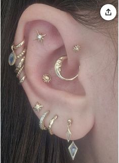 an ear with five different types of piercings on it