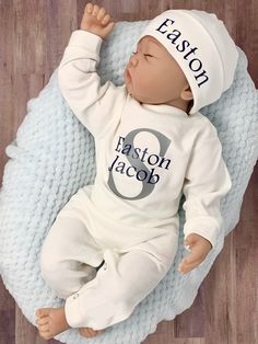 "100% Cotton This adorable customized super soft outfit will have everyone in admiration of your little one. This heat pressed customized bodysuit is the perfect outfit for any occasion! Also offers a coordinating cap! Did we mention how soft it is? An adorable customized outfit MADE JUST FOR YOU. This is the perfect coming home outfit, photo outfit, or even an every day outfit for that handsome little one of yours! Would also make an AWESOME gift! PLEASE include the name needed in the \"persona Welcome Home Outfit Ideas, Personalized Newborn Onesie, Newborn Baby Boy Outfits, Take Home Outfit Boy, Personalized Fitted Cute Onesie, Personalized Baby Hat Boys, Coming Home Outfit Boy, Personalized Newborn Outfit, Newborn Coming Home Outfit