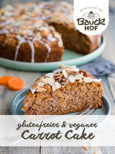 a close up of a slice of carrot cake on a plate with a fork in it