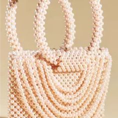 Elegant Beaded Vintage Satchel Product Details * Plastic Pearl Beads * Unlined * Imported Dimensions * 10"L, 8"H, 2"D * 5.5" Handle Drop Elegant Embellished Summer Bags, Summer Beaded Bag Fashion Accessory, Summer Beaded Bags As Fashion Accessory, Summer Fashion Beaded Bag, Elegant Beaded Summer Bags, Chic Beaded Shoulder Bag For Summer, Chic Summer Beaded Shoulder Bag, Elegant Embellished Shoulder Bag For Summer, Cream Beaded Bag For Summer