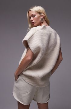 This boxy, wool-kissed sweater-vest is knit in an oversized silhouette with a V-neckline and fuzzy allover ribbing. 27" length (size Medium) V-neck Sleeveless 53% polyester, 41% acrylic, 5% wool, 1% elastane Machine wash, dry flat Imported Oversized Vest, Boxy Sweater, Oversize Knit, Fabric Gift Bags, Oversized Silhouette, Fabric Gifts, Knit Vest, Free Fabric, Sweater Vest